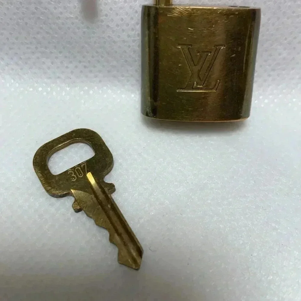 LOUIS VUITTON Lock & Key.  Key no: 307